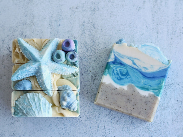 Sea themed soap in blue and sand colour with sea star and sea urchin decoration on top 
